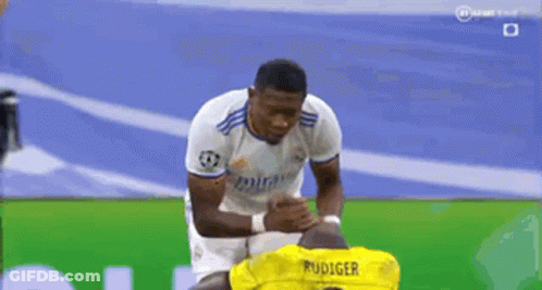 Soccer Player In Yellow Jersey Rudiger Kneeling GIF