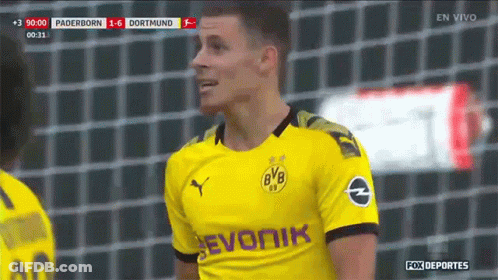 Soccer Player In Yellow Jersey Saying Evonik GIF