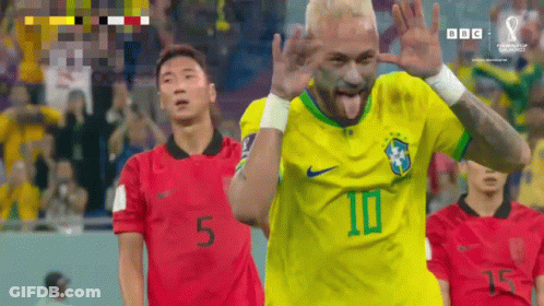 Soccer Player In Yellow Jersey Tongue Out GIF