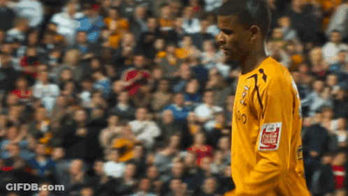 Soccer Player In Yellow Jersey With Coca Cola Logo GIF