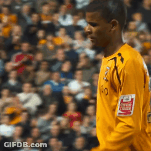 Soccer Player In Yellow Jersey With Coca-Cola Logo On Arm GIF