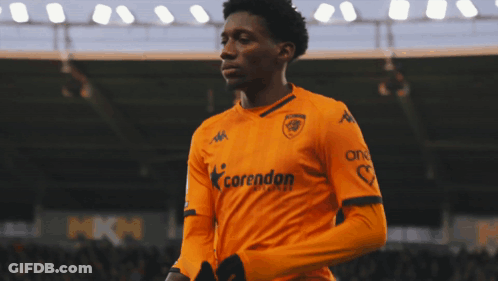 Soccer Player In Yellow Jersey With Land On Sleeve GIF