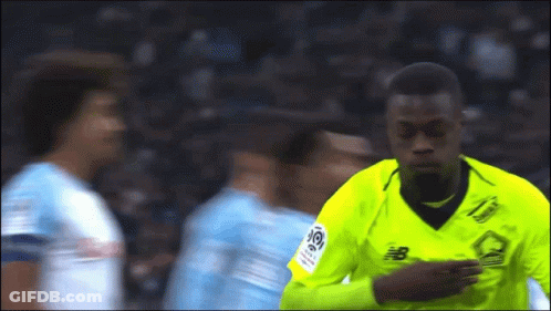 Soccer Player In Yellow Jersey With Letter B GIF