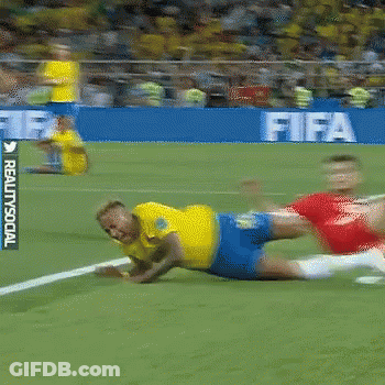 Soccer Player In Yellow Lying On Field GIF
