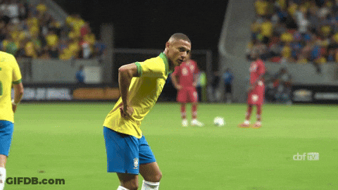Soccer Player In Yellow Shirt And Blue Shorts GIF