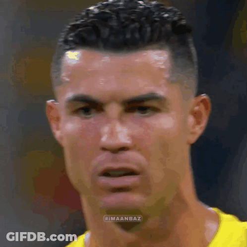 Soccer Player In Yellow Shirt Close Up GIF