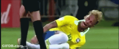 Soccer Player In Yellow Shirt Laying On Field GIF