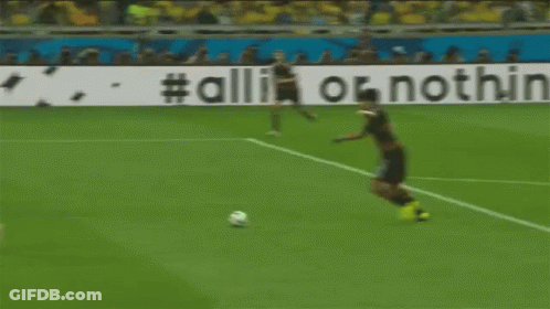 Soccer Player In Yellow Shirt Running Towards Adidas Goal GIF