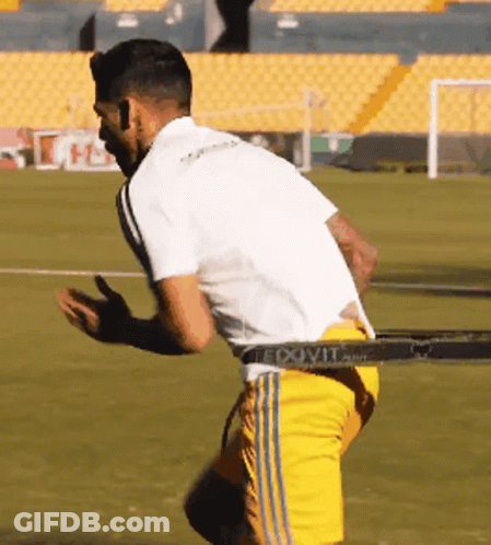 Soccer Player In Yellow Shorts And White Shirt GIF