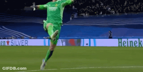 Soccer Player Jumping In Front Of Heineken Banner GIF
