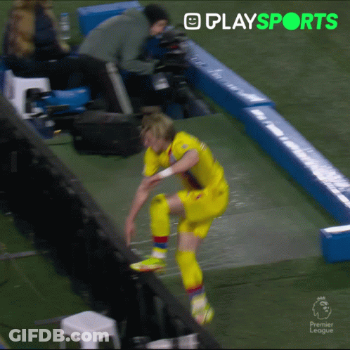 Soccer Player Jumping Over Fence GIF