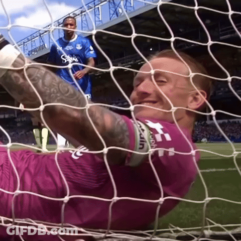 Soccer Player Jumping To Catch Ball GIF