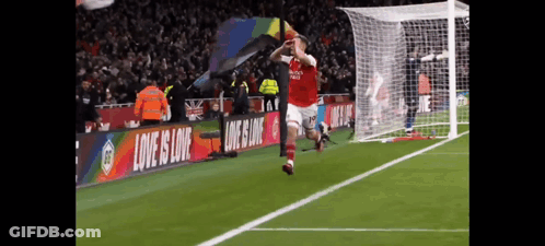 Soccer Player Jumping With Banner Love Is Love GIF