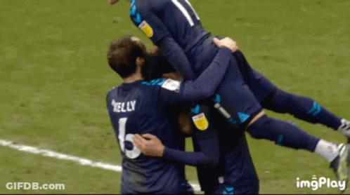 Soccer Player Kelly Jersey Lifted By Teammates GIF