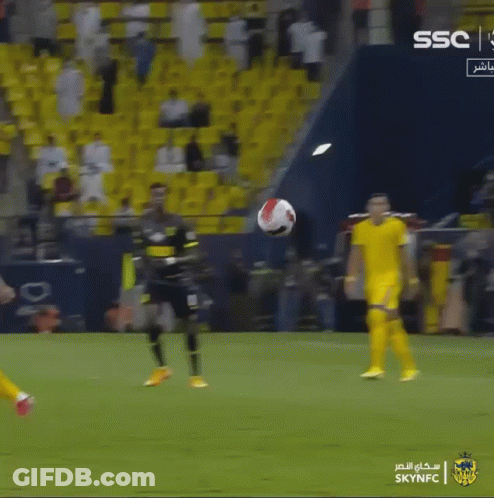 Soccer Player Kicking A Ball In Front Of A Sign That Says Ssc GIF