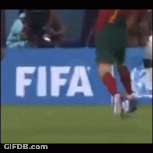 Soccer Player Kicking Ball At FIFA Sign GIF