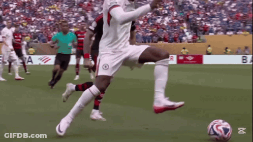 Soccer Player Kicking Ball By Banner Saying Ba GIF