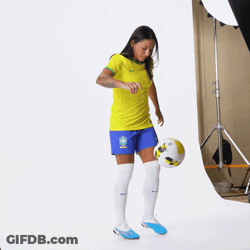 Soccer Player Kicking Ball In Blue Shorts GIF