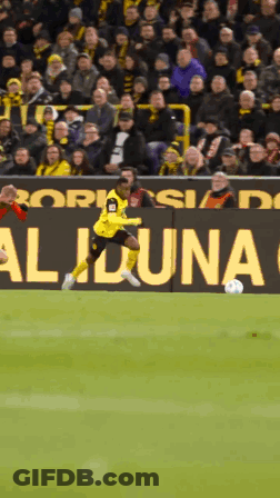 Soccer Player Kicking Ball In Front Of Aliona Sign GIF
