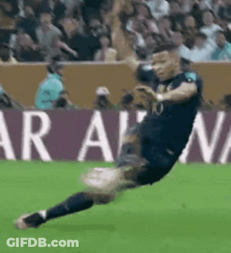 Soccer Player Kicking Ball In Front Of Aran Sign GIF