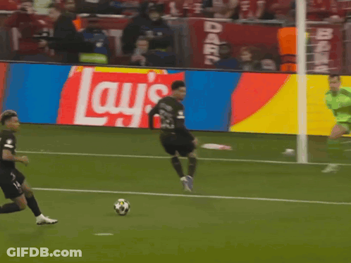 Soccer Player Kicking Ball In Front Of Lays Ad GIF