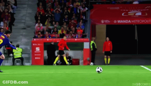 Soccer Player Kicking Ball In Front Of Wanda Metropolitan Banner GIF
