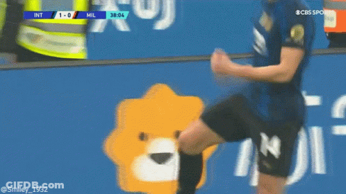 Soccer Player Kicking Ball Near Mil Sign GIF