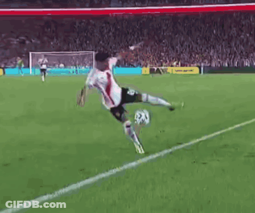 Soccer Player Kicking Ball On Field GIF