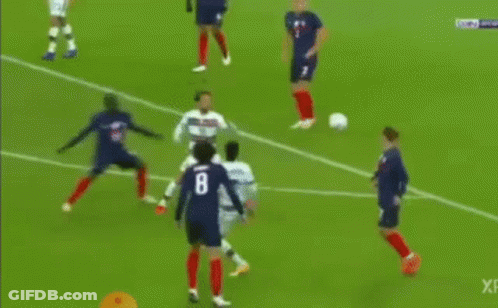 Soccer Player Kicking Ball Towards Goal With Goalkeeper GIF
