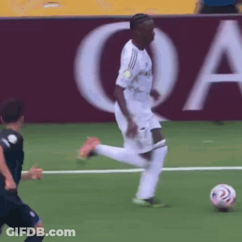Soccer Player Kicking Ball With QA Sign GIF
