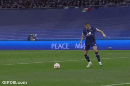 Soccer Player Kicks Ball At Peace Sign GIF