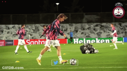 Soccer Player Kicks Ball Heineken Sign GIF