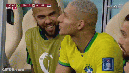 Soccer Player Kissing Teammate On Cheek GIF