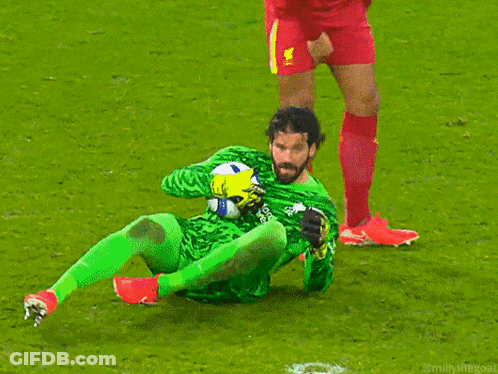 Soccer Player Kneeling Holding Ball GIF