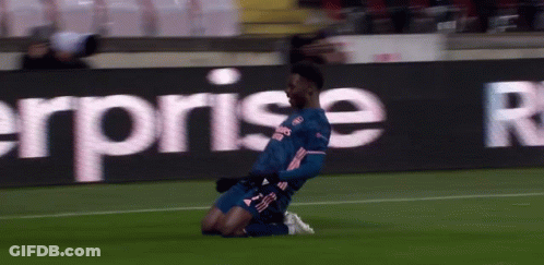 Soccer Player Kneeling In Front Of Sign GIF