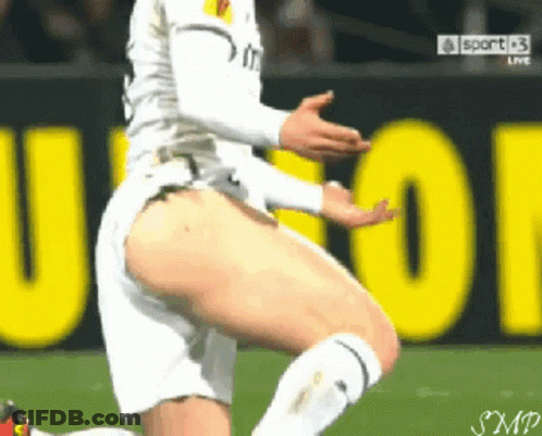 Soccer Player Kneeling In Front Of Sport Sign GIF