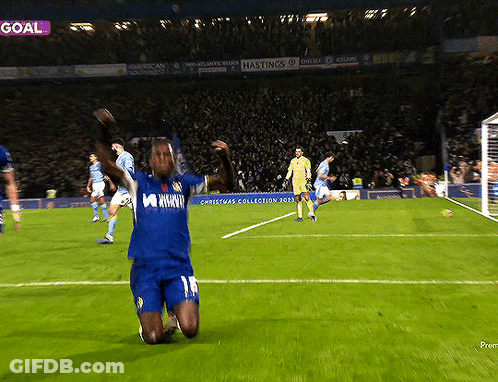 Soccer Player Kneeling On Field By Goal GIF