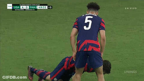 Soccer Player Laying On Ground Against Pan GIF