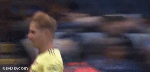 Soccer Player Laying On Ground In Front Of Crowd GIF