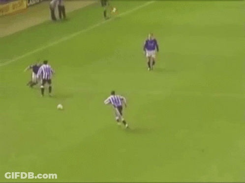 Soccer Player Laying On Ground Referee Helping GIF