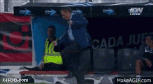 Soccer Player Laying On Stretcher In Dugout GIF