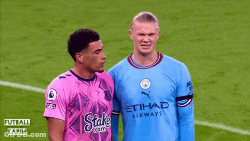 Soccer Player Laying, Two Others Talking And Watching GIF