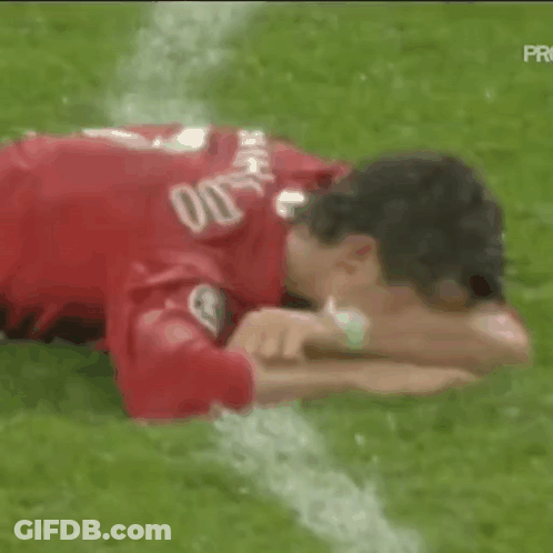 Soccer Player Lying On Field Head On Arms GIF
