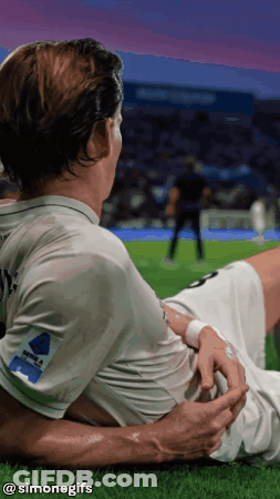 Soccer Player Lying On Grass Simonegifs GIF