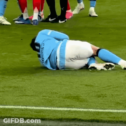 Soccer Player Lying On Ground GIF