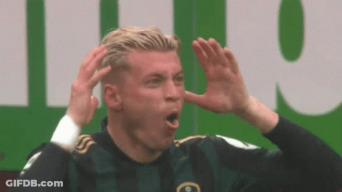 Soccer Player Making Funny Face In Green Jersey GIF
