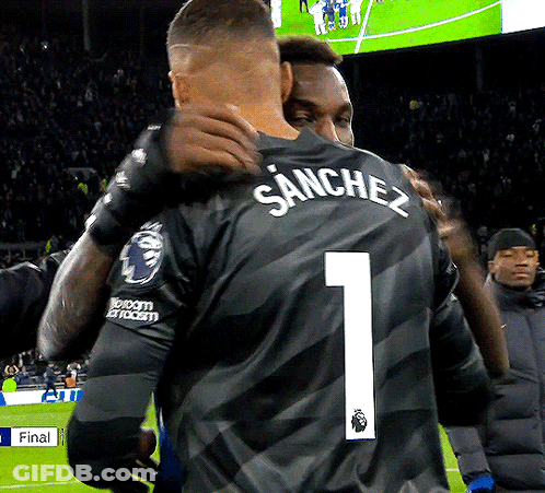 Soccer Player Number 1 Hugging Another Player GIF