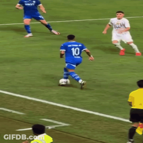 Soccer Player Number 10 Kicks Ball GIF