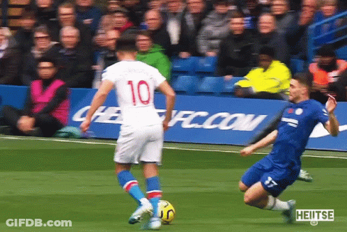 Soccer Player Number 10 Kicks Ball GIF