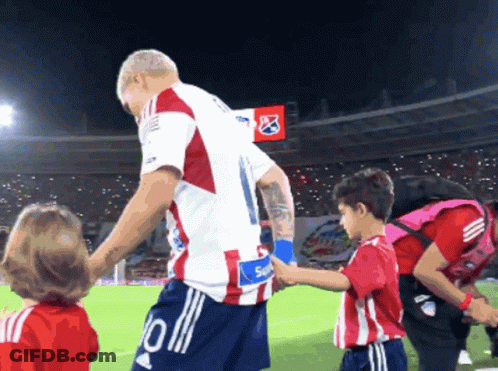 Soccer Player Number 10 Shaking Hands With Boy GIF